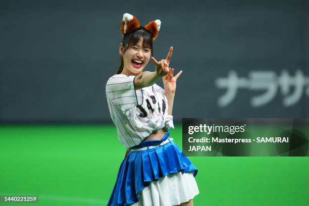 Hokkaido Nippon-Ham Fighters cheerleader performs a 'Kitsune Dance' or 'fox dance' during the game between Samurai Japan and Australia at Sapporo...