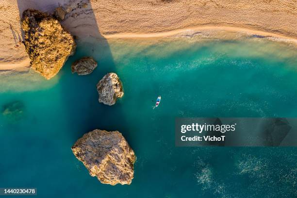 aerial landscape of turquoise water shore - golden hour beach stock pictures, royalty-free photos & images