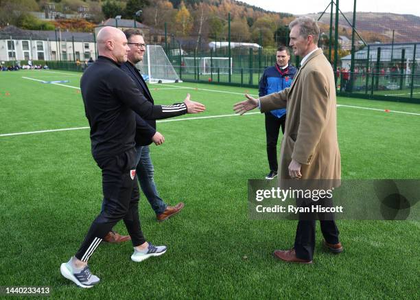 Rob Page, Manager of Wales, shakes hands with David Davies, Secretary of State for Wales, during the Rhondda Primary Schools Football Festival & 3G...