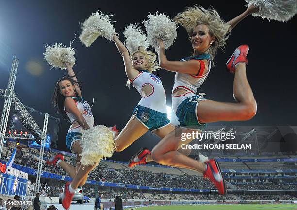 Cheerleaders perform prior to the start of the IPL Twenty20 cricket match between Deccan Chargers and Kings XI Punjab at the Rajiv Gandhi...