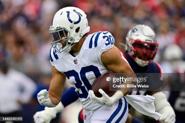 Phillip Lindsay of the Indianapolis Colts carries the ball before a game against the New England Patriots at Gillette Stadium on November 06, 2022 in...