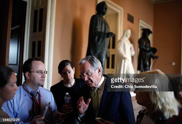 Sen. Tom Harkin speaks with reporters after a news conference about the student loan bill currently being debated by U.S. Senate at the U.S. Capitol...