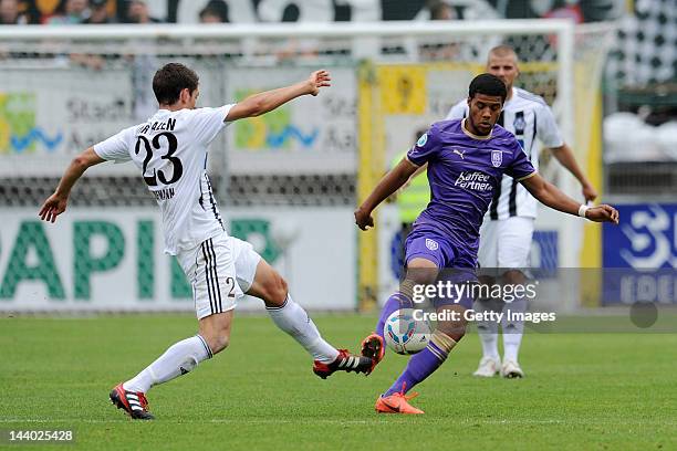 Andreas Hofmann of Aalen fights for the ball with Elias Kachunga of Osnabrueck during the Third League match between VfR Aalen and VfL Osnabrueck at...