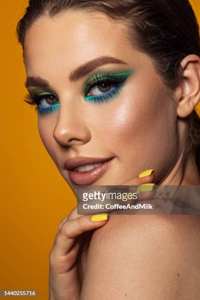 beautiful woman with bright make-up - yellow eyeshadow stock pictures, royalty-free photos & images