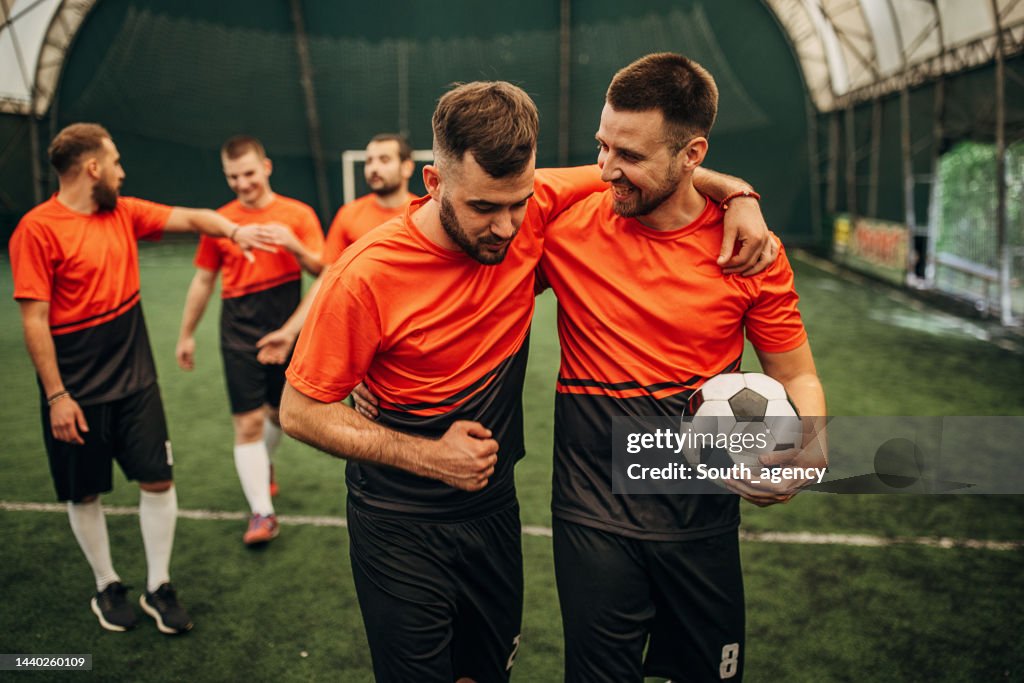 Soccer players leaving the field