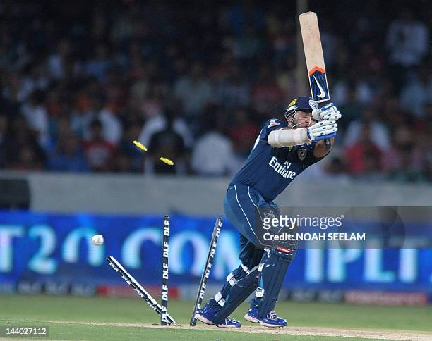 Deccan Chargers Batsman Parthiv Patel is bowled out by Kings XI Punjab bowler Parvinder Awana during the IPL Twenty20 cricket match between Deccan...