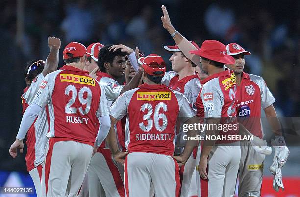 Kings XI Punjab bowler Parvinder Awana celebrates with teammates the wicket of Deccan Chargers Batsman Parthiv Patel during the IPL Twenty20 cricket...