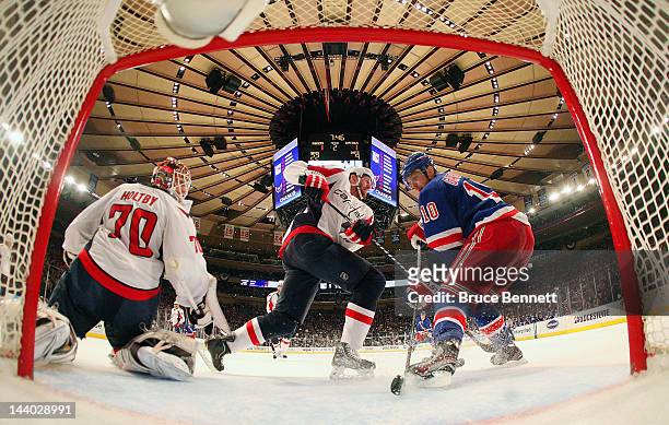 Braden Holtby of the Washington Capitals tends goal against Marian Gaborik of the New York Rangers in Game Five of the Eastern Conference Semifinals...