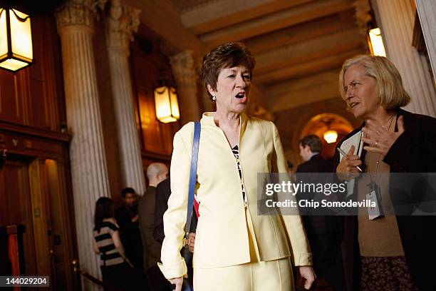 Sen. Susan Collins talks with a reporter before heading to the Senate Republican Caucus policy luncheon May 8, 2012 in Washington, DC. Moments...