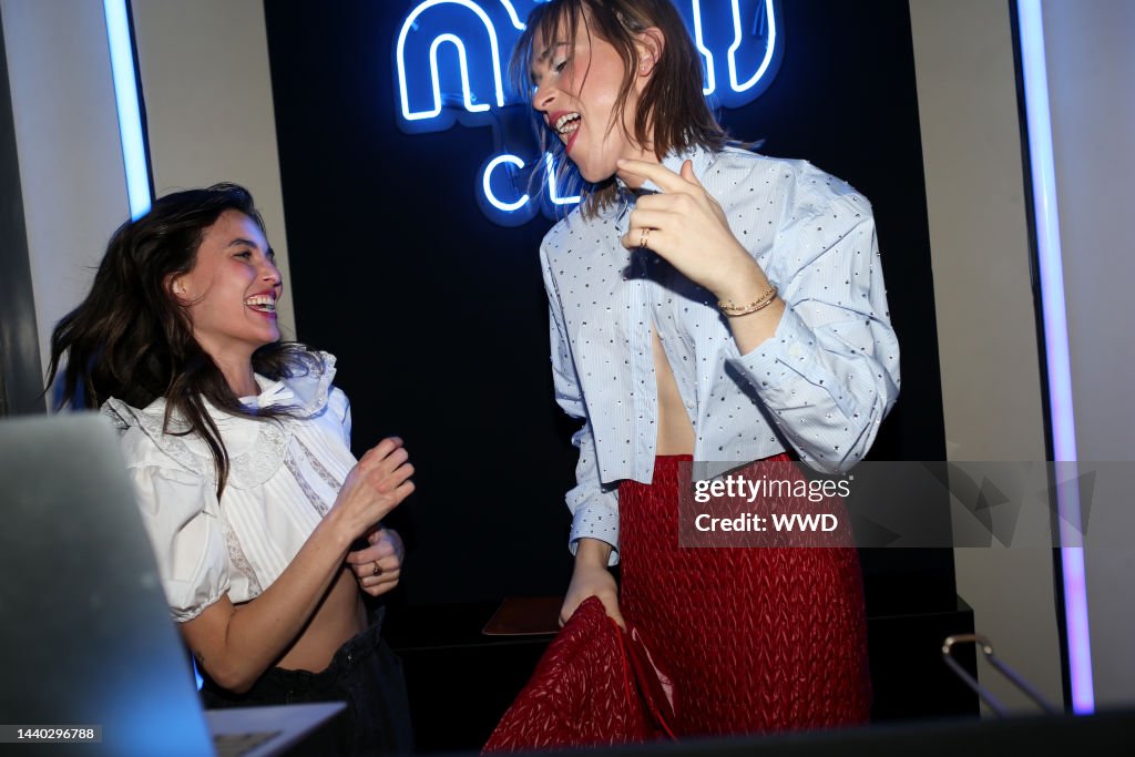 Rainey Qualley and Tommy Dorfman attend the Miu Miu Nuit Club party