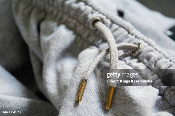 jogging pants - grey belt stock pictures, royalty-free photos & images