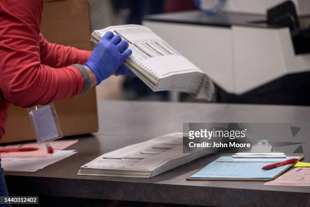 Election workers sort ballots at the Maricopa County Tabulation and Election Center on November 09, 2022 in Phoenix, Arizona. A day after the Midterm...