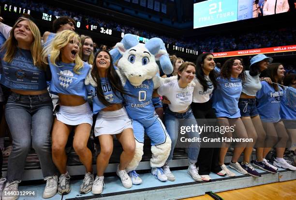 Mascot Rameses Jr. And North Carolina Tar Heels fans dance during their game against the North Carolina-Wilmington Seahawks at the Dean E. Smith...