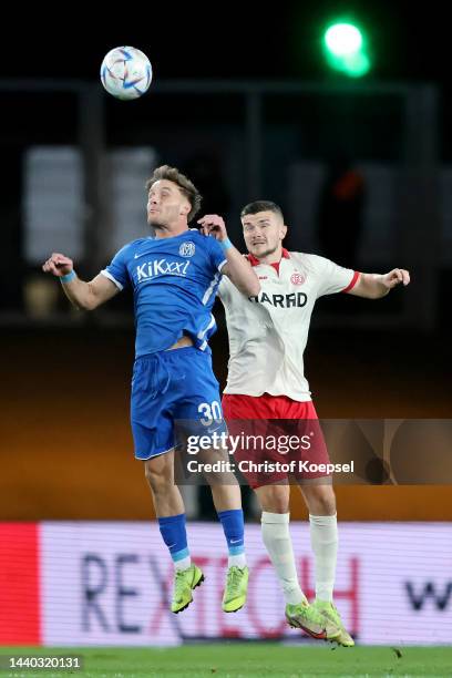 Mirnes Pepic of Meppen and Ron Berlinski of Essen go up for a header during the 3. Liga match between Rot-Weiss Essen and SV Meppen at Stadion an der...