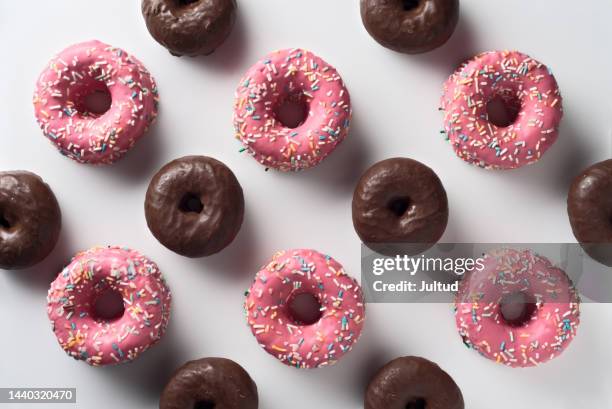 group of strawberry and chocolate glazed doughnuts - chocolate cake above stock pictures, royalty-free photos & images