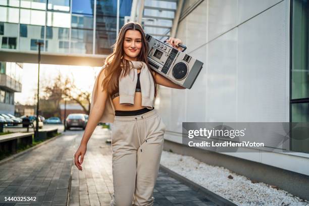 young woman with a boom box - girls boom box stock pictures, royalty-free photos & images