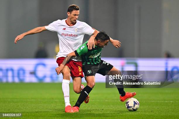Nemanja Matic of AS Roma is challenged by Luca D'Andrea of US Sassuolo during the Serie A match between US Sassuolo and AS Roma at Mapei Stadium -...