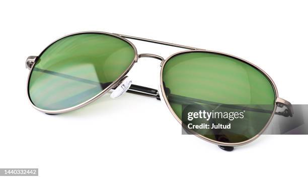 close-up shot of green sunglasses isolated on white background - sunglasses without people stock-fotos und bilder