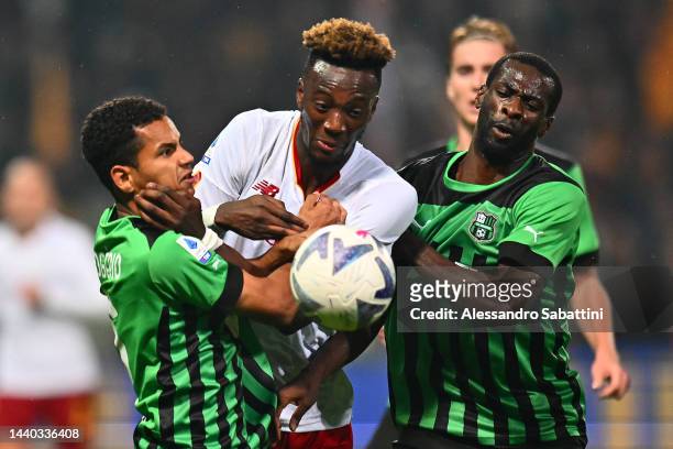 Tammy Abraham of AS Roma battles for possession with Rogerio and Pedro Obiang of US Sassuolo during the Serie A match between US Sassuolo and AS Roma...