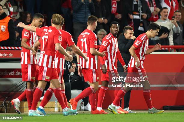 Sheraldo Becker of 1.FC Union Berlin celebrates with team mates after scoring their sides first goal during the Bundesliga match between 1. FC Union...
