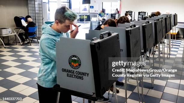 November 08: A voter casts his ballot at a voting center at Irvine Valley College in Irvine, CA on Tuesday, November 8, 2022.