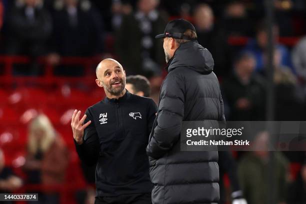 Paul Warne, Manager of Derby County interacts with Jurgen Klopp, Manager of Liverpool prior to the Carabao Cup Third Round match between Liverpool...