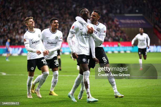 Randal Kolo Muani of Eintracht Frankfurt celebrates with team mates after scoring their sides second goal during the Bundesliga match between...