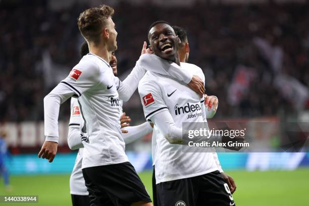 Randal Kolo Muani of Eintracht Frankfurt celebrates with team mates after scoring their sides second goal during the Bundesliga match between...