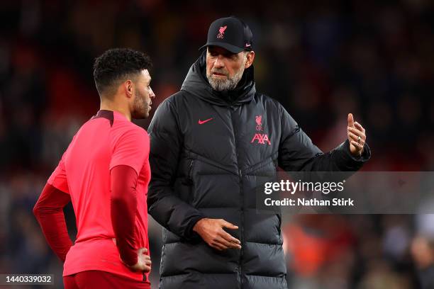 Jurgen Klopp, Manager of Liverpool interacts with Alex Oxlade-Chamberlain of Liverpool prior to the Carabao Cup Third Round match between Liverpool...