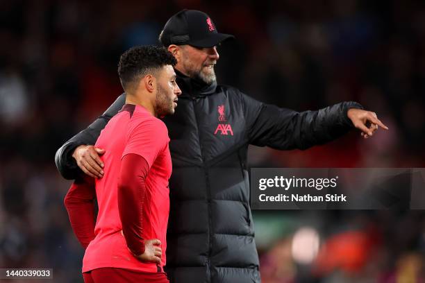 Jurgen Klopp, Manager of Liverpool interacts with Alex Oxlade-Chamberlain of Liverpool prior to the Carabao Cup Third Round match between Liverpool...