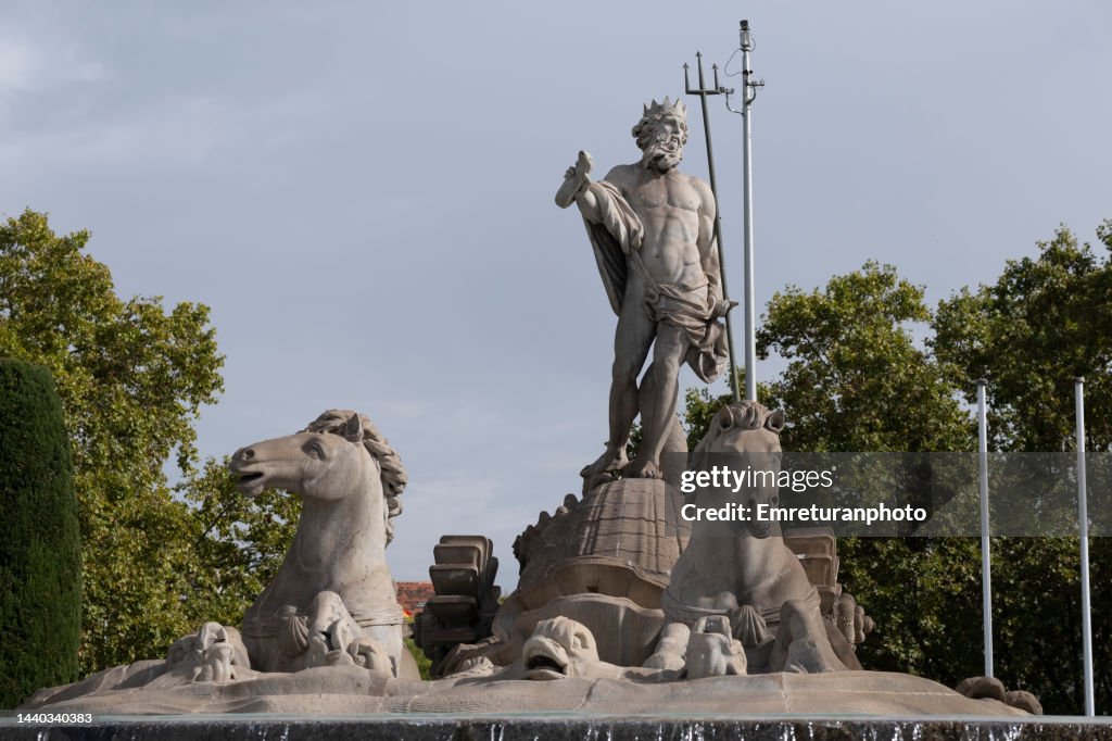 Front view of the neptune fountain in Madrid on a sunny day.