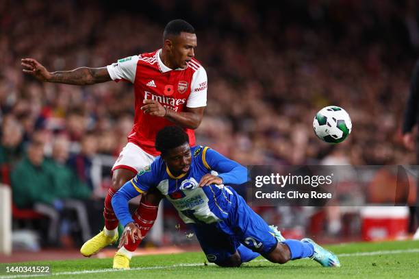 Marquinhos of Arsenal battles for possession with Tariq Lamptey of Brighton & Hove Albion during the Carabao Cup Third Round match between Arsenal...