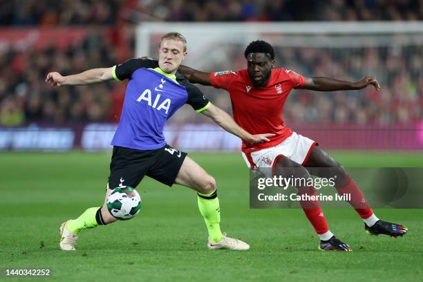 Oliver Skipp of Tottenham Hotspur holds off Orel Mangala of Nottingham Forest during the Carabao Cup Third Round match between Nottingham Forest and...