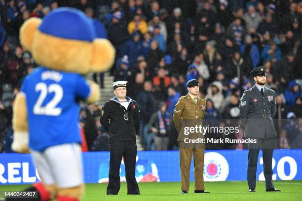 Members of the British Armed services stand in the centre circle to show their support for remembrance day 2022 during the Cinch Scottish Premiership...