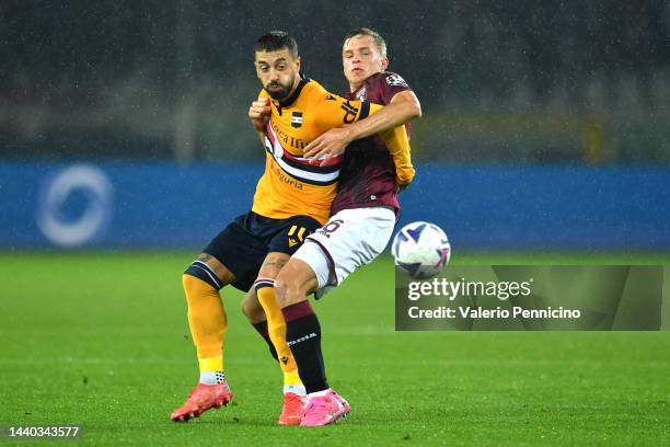 Francesco Caputo of UC Sampdoria battles for possession with David Zima of Torino FC during the Serie A match between Torino FC and UC Sampdoria at...