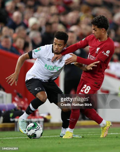 Korey Smith of Derby County holds off Fabio Carvalho of Liverpool during the Carabao Cup Third Round match between Liverpool and Derby County at...