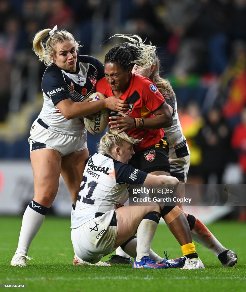 Gracefield Rugby Rngland Michelle John of Papua New Guinea is tackled by Grace Field and Keara ...
