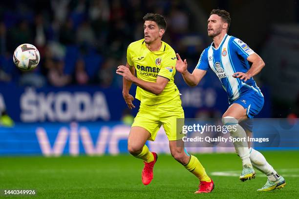 Sergi Gomez of RCD Espanyol competes for the ball with Gerard Moreno of Villarreal CF during the LaLiga Santander match between RCD Espanyol and...