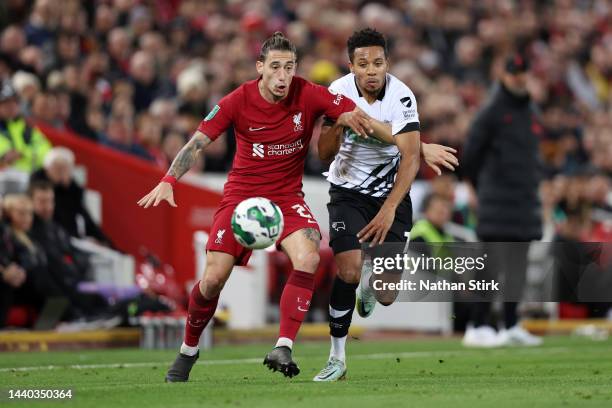 Kostas Tsimikas of Liverpool battles for possession with Louie Sibley of Derby County during the Carabao Cup Third Round match between Liverpool and...