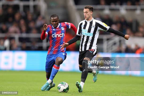 Javi Manquillo of Newcastle United is challenged by Tyrick Mitchell of Crystal Palace during the Carabao Cup Third Round match between Newcastle...