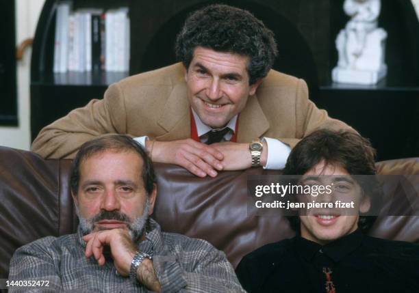 French director, screenwriter and producer Claude Lelouch with French actors Jean Yanne and Patrick Bruel, on the set of his film “Attention...