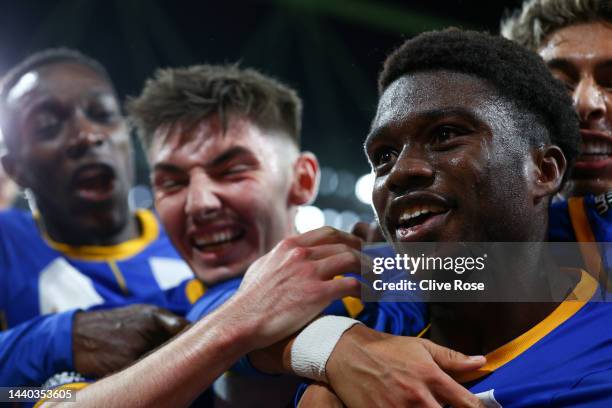 Tariq Lamptey of Brighton & Hove Albion celebrates with teammates after scoring their team's third goal during the Carabao Cup Third Round match...