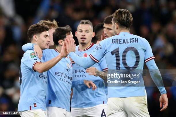 Julian Alvarez of Manchester City celebrates with teammates after scoring their team's second goal during the Carabao Cup Third Round match between...
