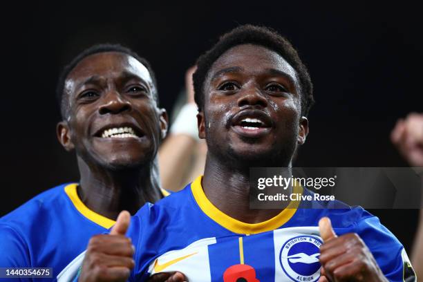 Tariq Lamptey of Brighton & Hove Albion celebrates with teammate Danny Welbeck after scoring their team's third goal during the Carabao Cup Third...