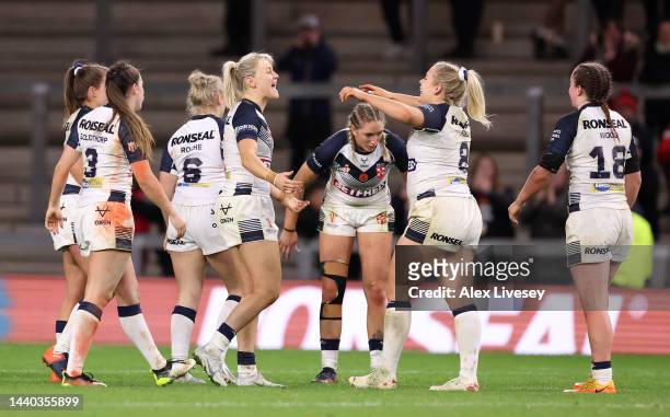 Players of England celebrate following the Women's Rugby League World Cup Group A match between England Women and Papua New Guinea Women at...