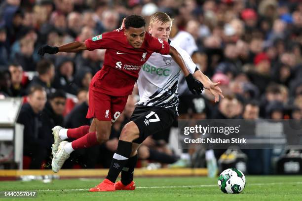 Melkamu Frauendorf of Liverpool is fouled by Louie Sibley of Derby County during the Carabao Cup Third Round match between Liverpool and Derby County...