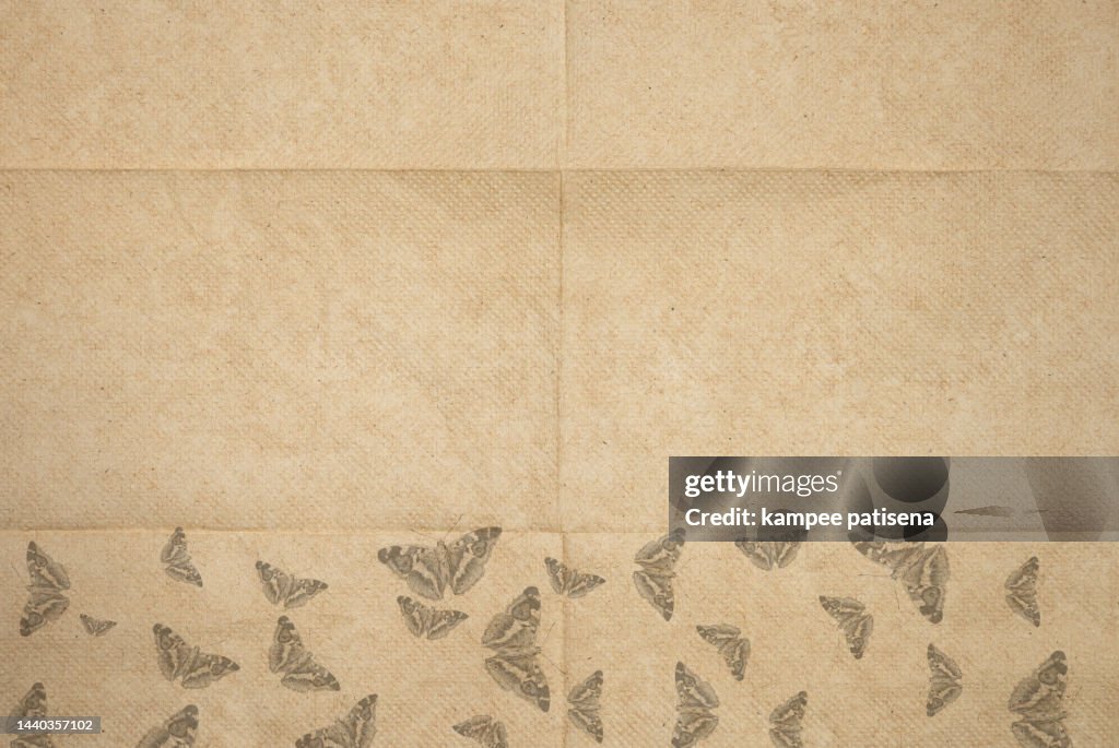Abstract background from texture of brown toilet paper.