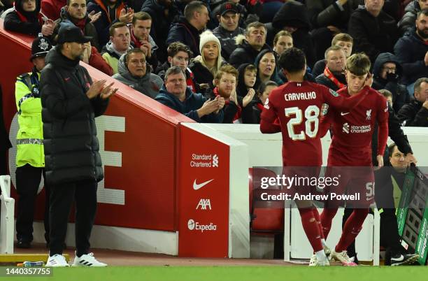 Fabio Carvalho of Liverpool goes off and B.Doak of Liverpool comes on during the Carabao Cup Third Round match between Liverpool and Derby County at...