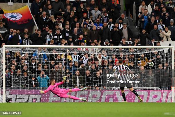 Chris Wood of Newcastle United scores their sides penalty during a penalty shoot out during the Carabao Cup Third Round match between Newcastle...