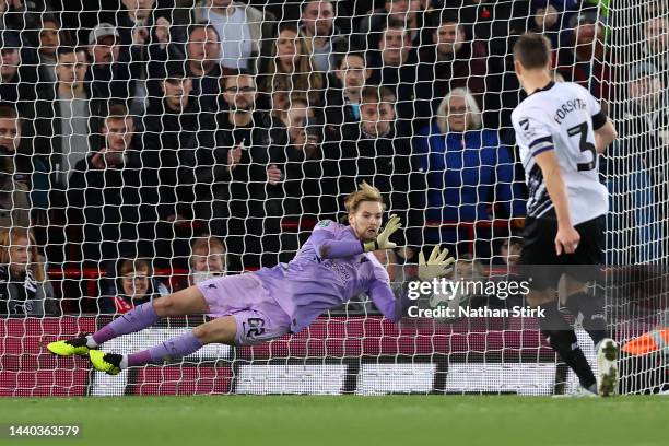 Caoimhin Kelleher of Liverpool saves a penalty taken by Craig Forsyth of Derby County during a penalty shoot out during the Carabao Cup Third Round...